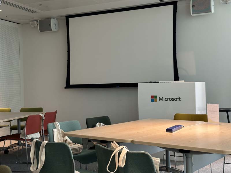 Microsoft Azure Master Class training room with Projector Screen and tables with chairs - September 2023